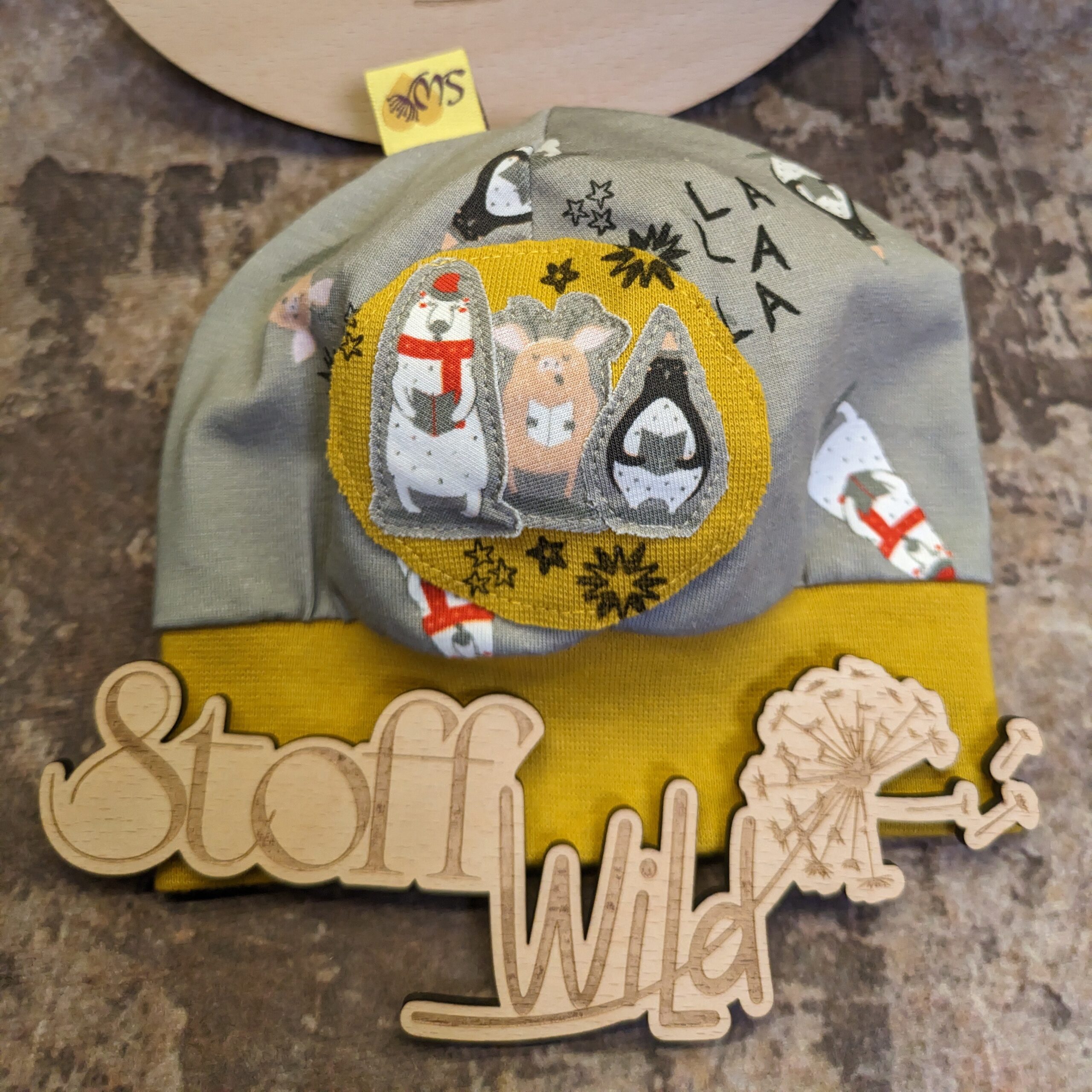 Bündchenhaube WinterTiere ocker, Gr. S